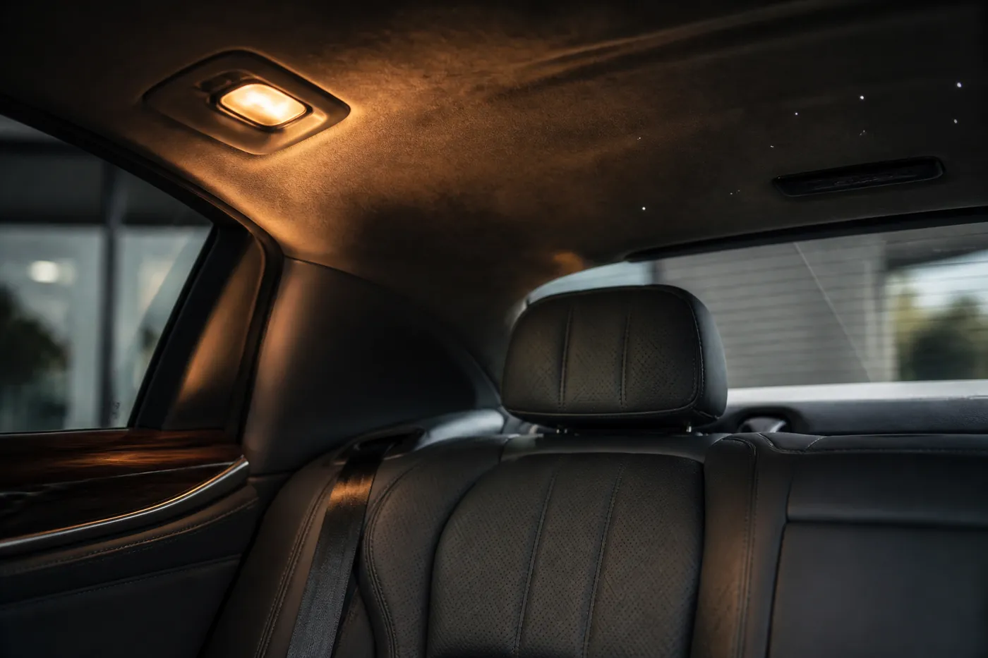 A rear compartment lit for reading — the cabin detail this class of motor car is booked for