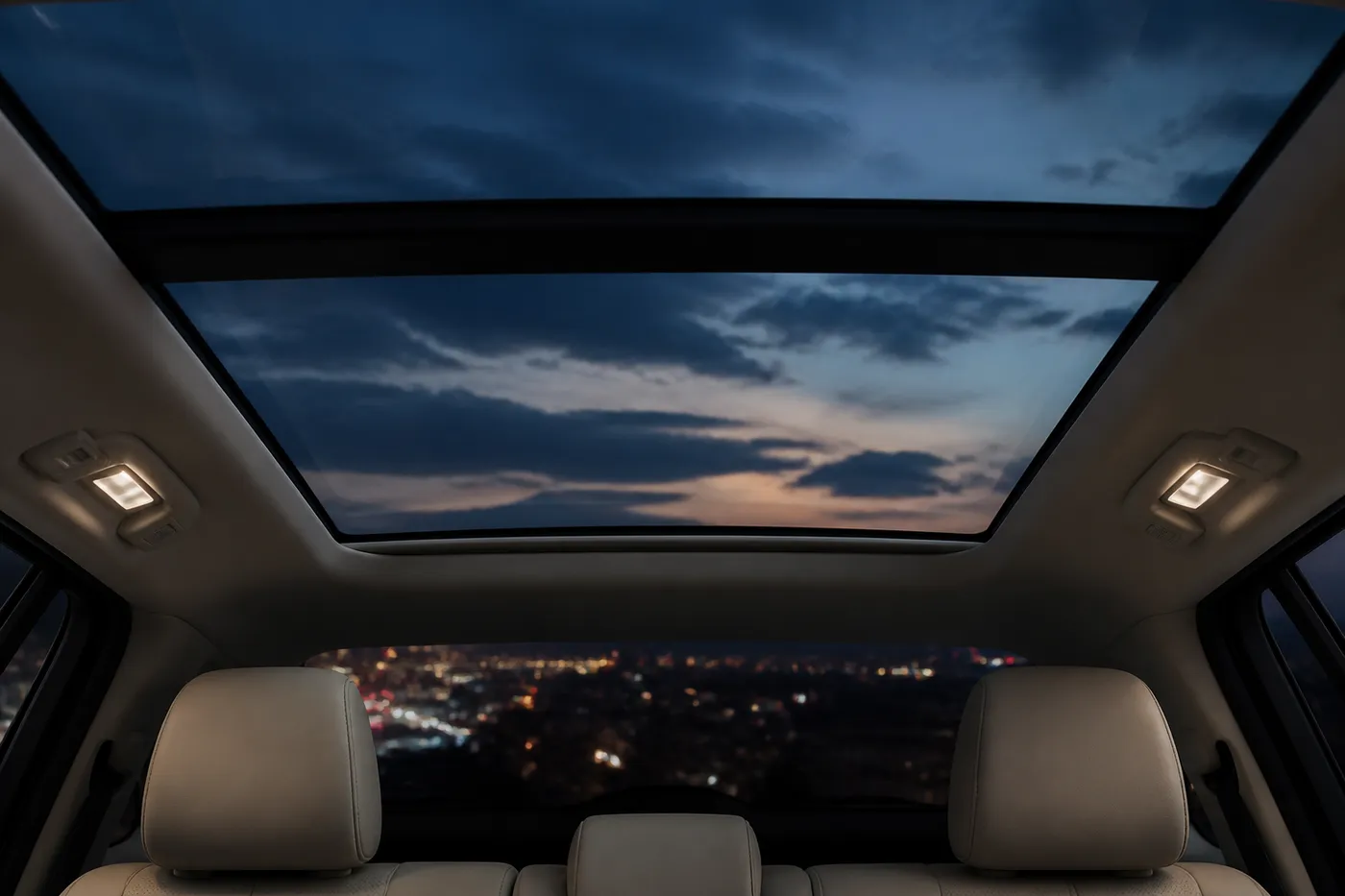 A passenger reading in the rear cabin beneath the panoramic roof